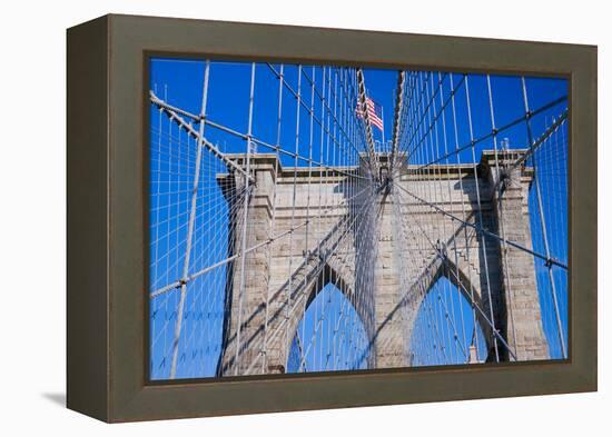 American flag flying over Brooklyn Bridge, New York City, New York-null-Framed Premier Image Canvas