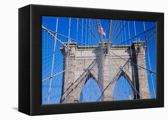 American flag flying over Brooklyn Bridge, New York City, New York-null-Framed Premier Image Canvas