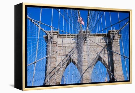 American flag flying over Brooklyn Bridge, New York City, New York-null-Framed Premier Image Canvas