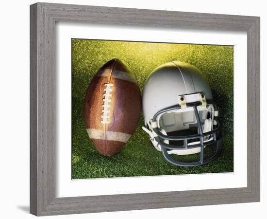 American Football Helmet and a Football-null-Framed Photographic Print