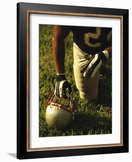 American Football Player Kneeling on the Field-null-Framed Photographic Print