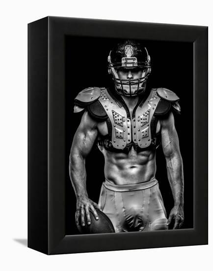 American Football Player with Ball Wearing Helmet and Protective Shields-NejroN Photo-Framed Premier Image Canvas