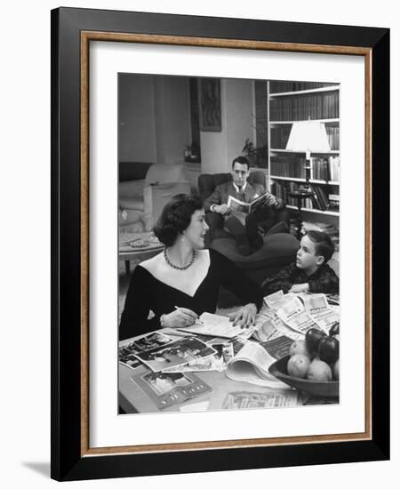 American Housewife Margaret Carson Sitting at Home with Her Husband and Son-Nina Leen-Framed Photographic Print