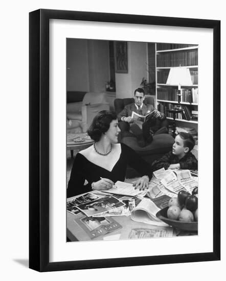 American Housewife Margaret Carson Sitting at Home with Her Husband and Son-Nina Leen-Framed Photographic Print