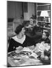American Housewife Margaret Carson Sitting at Home with Her Husband and Son-Nina Leen-Mounted Photographic Print