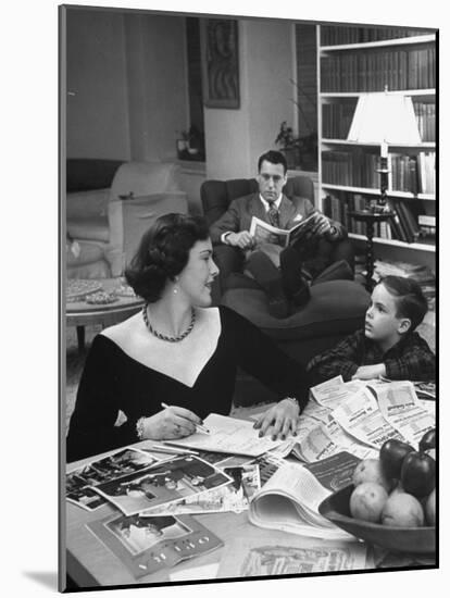 American Housewife Margaret Carson Sitting at Home with Her Husband and Son-Nina Leen-Mounted Photographic Print