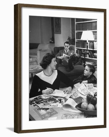 American Housewife Margaret Carson Sitting at Home with Her Husband and Son-Nina Leen-Framed Photographic Print