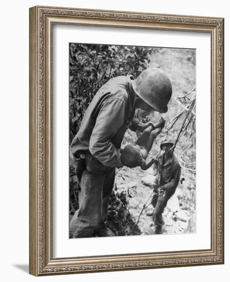 American Lieutenant Carrying Micronesian Baby He Found in cave Japanese Soldiers Holed Up There-W^ Eugene Smith-Framed Photographic Print