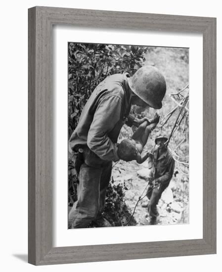 American Lieutenant Carrying Micronesian Baby He Found in cave Japanese Soldiers Holed Up There-W^ Eugene Smith-Framed Photographic Print