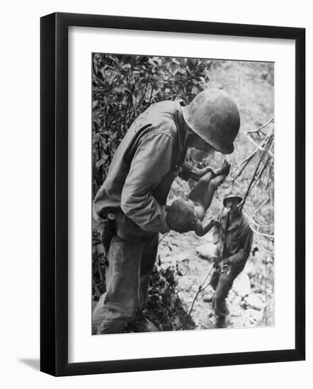 American Lieutenant Carrying Micronesian Baby He Found in cave Japanese Soldiers Holed Up There-W^ Eugene Smith-Framed Photographic Print