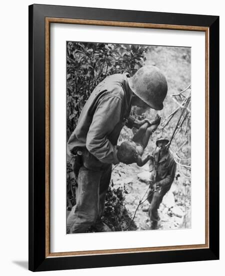 American Lieutenant Carrying Micronesian Baby He Found in cave Japanese Soldiers Holed Up There-W^ Eugene Smith-Framed Photographic Print