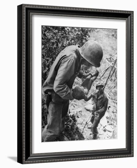 American Lieutenant Carrying Micronesian Baby He Found in cave Japanese Soldiers Holed Up There-W^ Eugene Smith-Framed Photographic Print