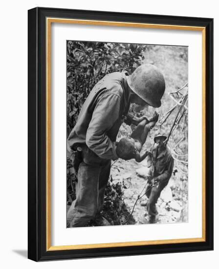 American Lieutenant Carrying Micronesian Baby He Found in cave Japanese Soldiers Holed Up There-W^ Eugene Smith-Framed Photographic Print