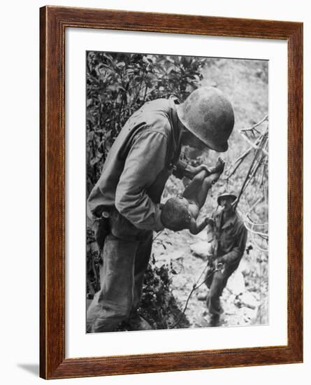 American Lieutenant Carrying Micronesian Baby He Found in cave Japanese Soldiers Holed Up There-W^ Eugene Smith-Framed Photographic Print