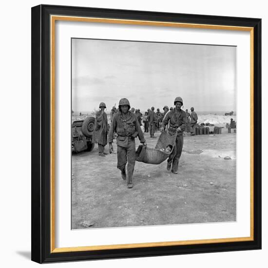 American Marines Carrying a Wounded Child to an Aid Station after the Invasion of Saipan-Peter Stackpole-Framed Photographic Print