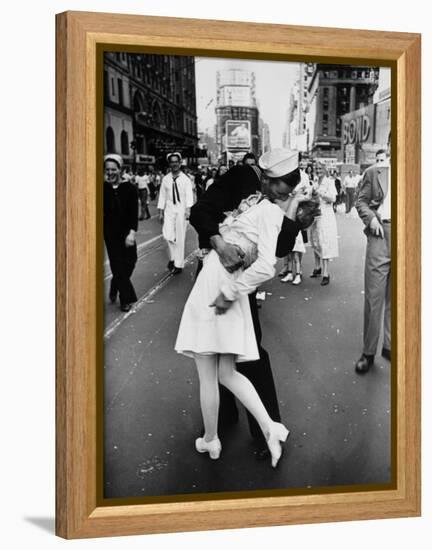 American Sailor Clutching a White-Uniformed Nurse in a Passionate Kiss in Times Square-Alfred Eisenstaedt-Framed Premier Image Canvas