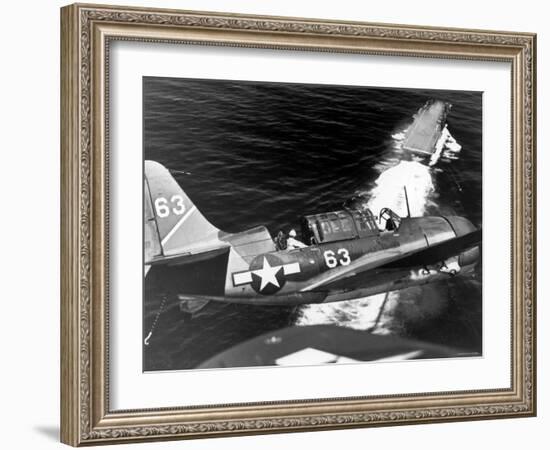American SB2C Scout Plane Circling Above an Aircraft Carrier Prior to Landing-null-Framed Photographic Print