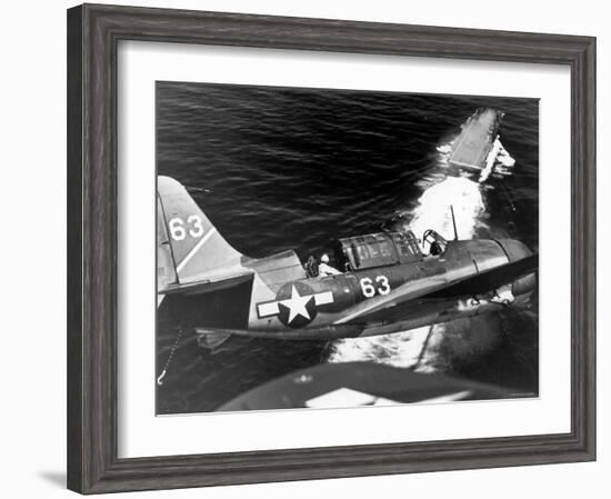 American SB2C Scout Plane Circling Above an Aircraft Carrier Prior to Landing-null-Framed Photographic Print