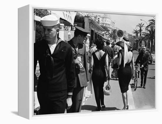 American Serviceman Admiring Two Female Pedestrians at the Cannes Film Festival-Paul Schutzer-Framed Premier Image Canvas