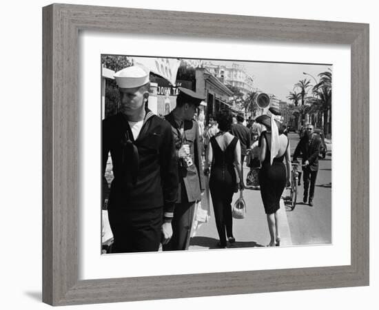 American Serviceman Admiring Two Female Pedestrians at the Cannes Film Festival-Paul Schutzer-Framed Photographic Print