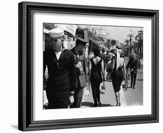 American Serviceman Admiring Two Female Pedestrians at the Cannes Film Festival-Paul Schutzer-Framed Photographic Print