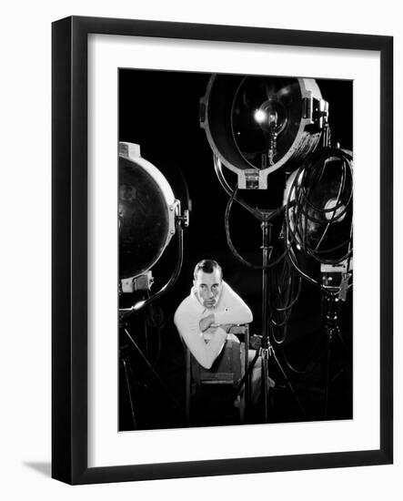 American silent screen comedian and actor Buster Keaton (1895 - 1966) surrounded by studio lighting-null-Framed Photo