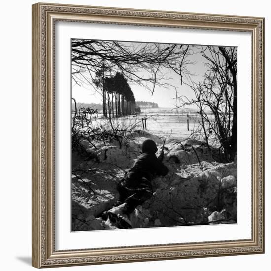 American Soldier Peering Across Snowy Field During Counter Offensive Known as Battle of the Bulge-John Florea-Framed Photographic Print