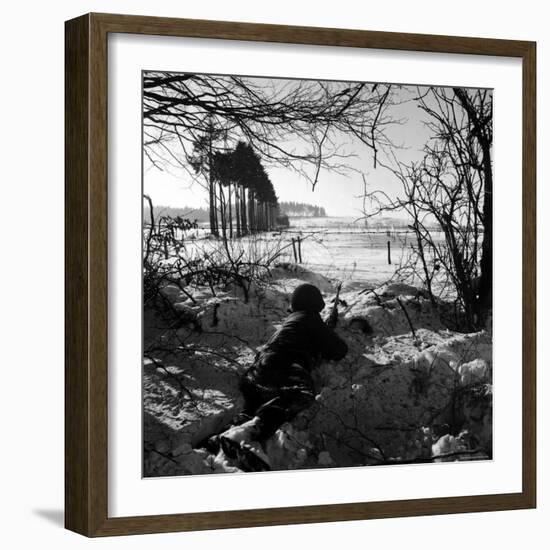 American Soldier Peering Across Snowy Field During Counter Offensive Known as Battle of the Bulge-John Florea-Framed Photographic Print