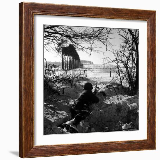 American Soldier Peering Across Snowy Field During Counter Offensive Known as Battle of the Bulge-John Florea-Framed Photographic Print