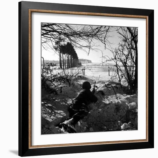 American Soldier Peering Across Snowy Field During Counter Offensive Known as Battle of the Bulge-John Florea-Framed Photographic Print