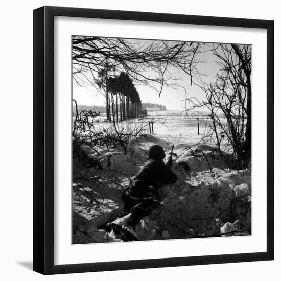 American Soldier Peering Across Snowy Field During Counter Offensive Known as Battle of the Bulge-John Florea-Framed Photographic Print