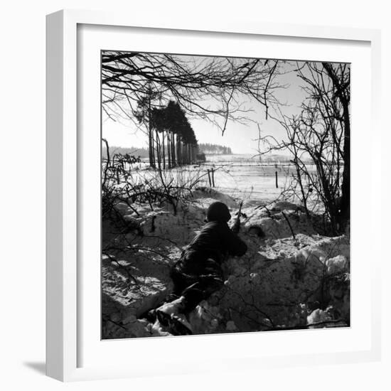 American Soldier Peering Across Snowy Field During Counter Offensive Known as Battle of the Bulge-John Florea-Framed Photographic Print