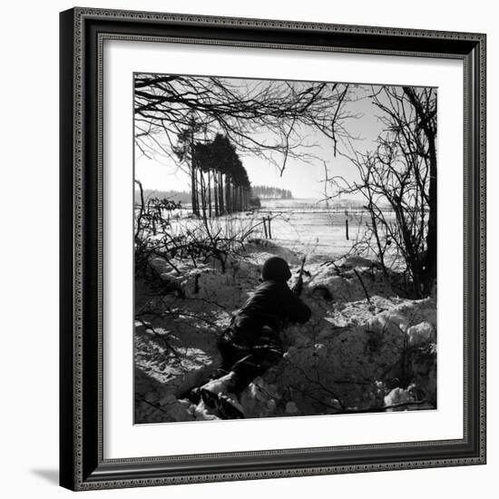 American Soldier Peering Across Snowy Field During Counter Offensive Known as Battle of the Bulge-John Florea-Framed Photographic Print