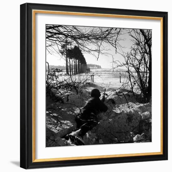 American Soldier Peering Across Snowy Field During Counter Offensive Known as Battle of the Bulge-John Florea-Framed Photographic Print