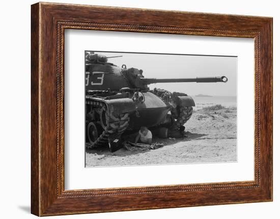 American soldier reads a newspaper in the shade under a U.S. Marine tank in Beirut, Lebanon, 1958-Thomas J. O'halloran-Framed Photographic Print