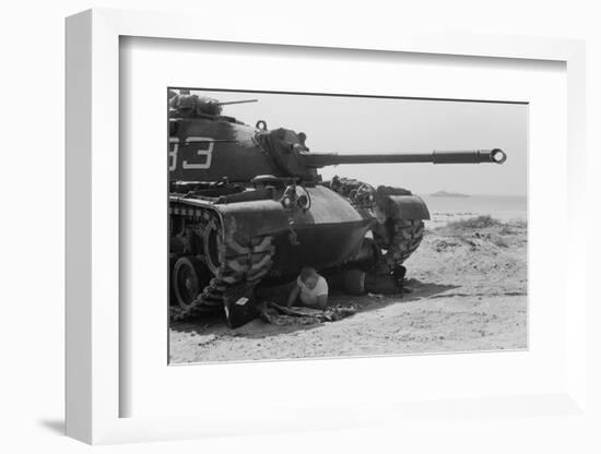 American soldier reads a newspaper in the shade under a U.S. Marine tank in Beirut, Lebanon, 1958-Thomas J. O'halloran-Framed Photographic Print