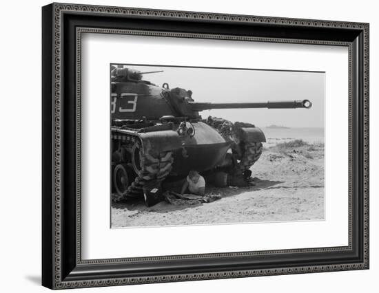 American soldier reads a newspaper in the shade under a U.S. Marine tank in Beirut, Lebanon, 1958-Thomas J. O'halloran-Framed Photographic Print