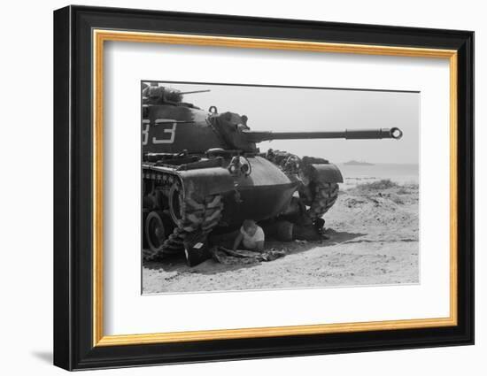 American soldier reads a newspaper in the shade under a U.S. Marine tank in Beirut, Lebanon, 1958-Thomas J. O'halloran-Framed Photographic Print