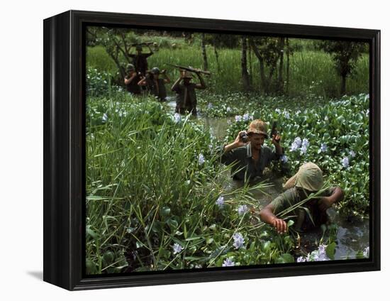 American Soldiers Wade Through Marshy Area During the Vietnam War-Paul Schutzer-Framed Premier Image Canvas