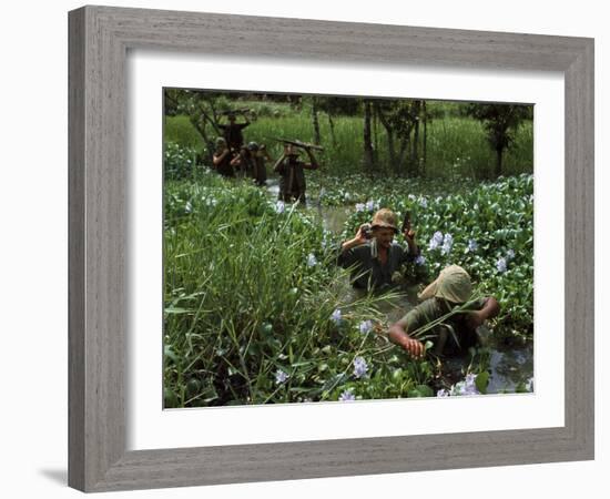 American Soldiers Wade Through Marshy Area During the Vietnam War-Paul Schutzer-Framed Photographic Print