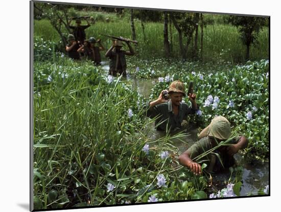 American Soldiers Wade Through Marshy Area During the Vietnam War-Paul Schutzer-Mounted Photographic Print