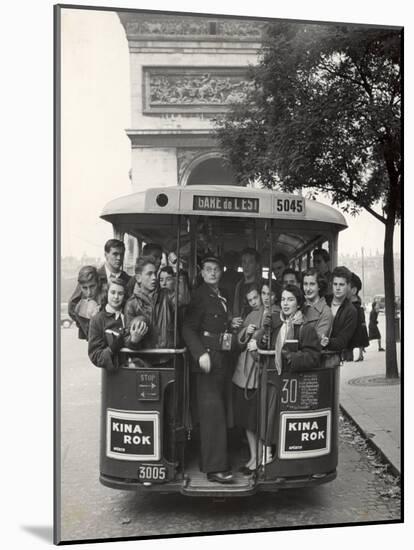 American Teenagers Riding Streetcar Towards Arc de Triomphe, Head Home-Gordon Parks-Mounted Photographic Print