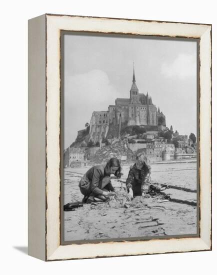 American Travelers Building a Sand Replica of France's Medieval Abbey at Mont Saint Michel-Yale Joel-Framed Premier Image Canvas