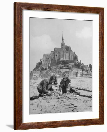 American Travelers Building a Sand Replica of France's Medieval Abbey at Mont Saint Michel-Yale Joel-Framed Photographic Print