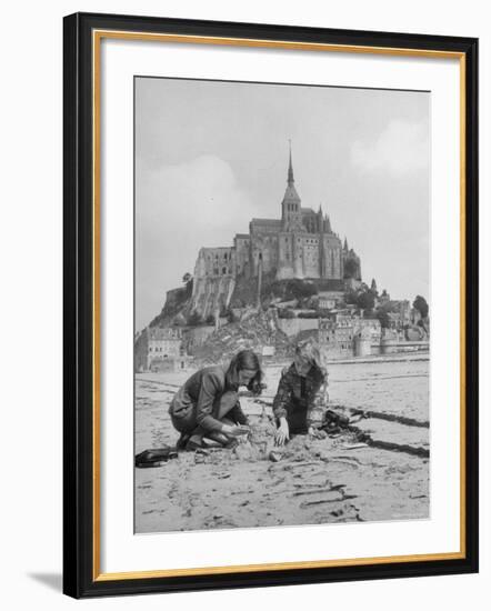 American Travelers Building a Sand Replica of France's Medieval Abbey at Mont Saint Michel-Yale Joel-Framed Photographic Print