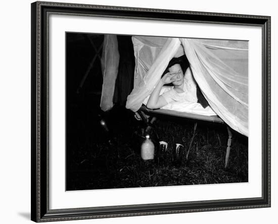 American Wac Raises the Netting over Her Cot as a Photographer's Flash Illuminates the Scene-null-Framed Photo