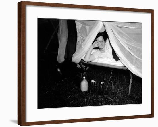 American Wac Raises the Netting over Her Cot as a Photographer's Flash Illuminates the Scene-null-Framed Photo