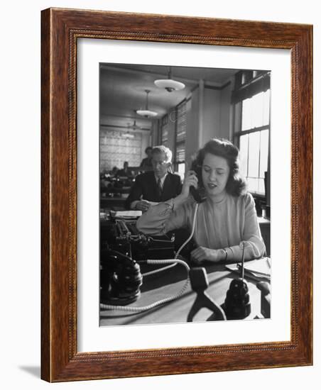 American Working Woman Sitting at Her Typewriter and Talking on the Telephone-Nina Leen-Framed Photographic Print