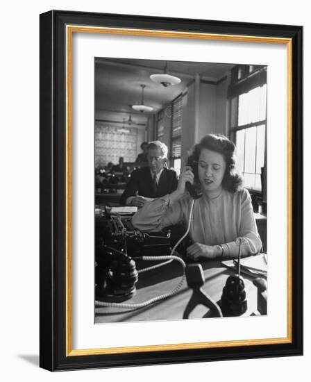 American Working Woman Sitting at Her Typewriter and Talking on the Telephone-Nina Leen-Framed Photographic Print