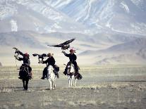 Takhuu Raising His Eagle, Golden Eagle Festival, Mongolia-Amos Nachoum-Photographic Print